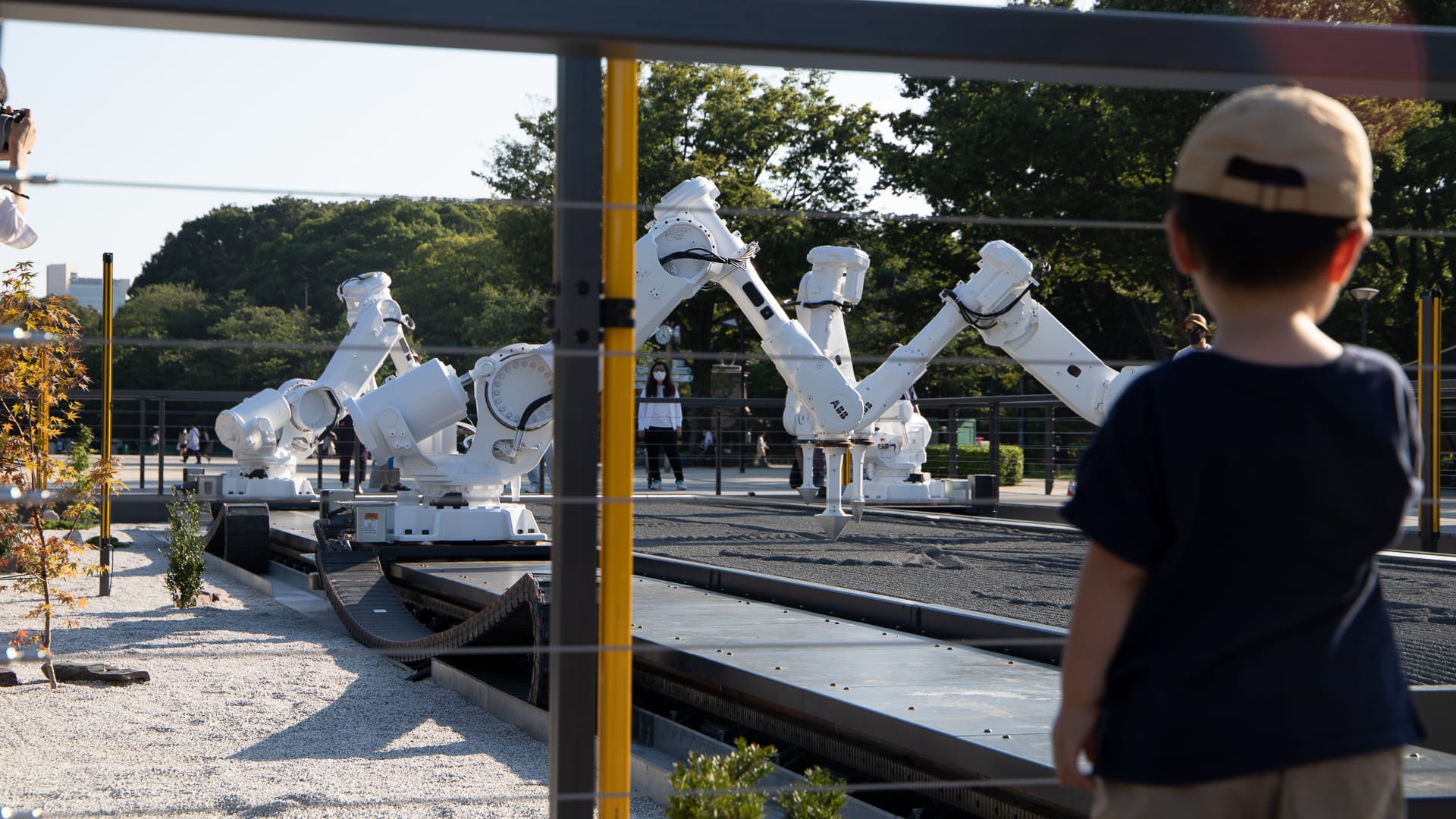 Robots draw in unison during a performance